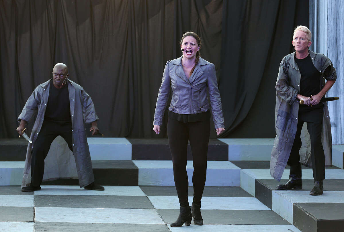 Actors James “Apollo” Bradley (from left), Melissa Gonzalez and Damian Gillen perform the opening scene from Shakespeare in the Park's “Hamlet.”