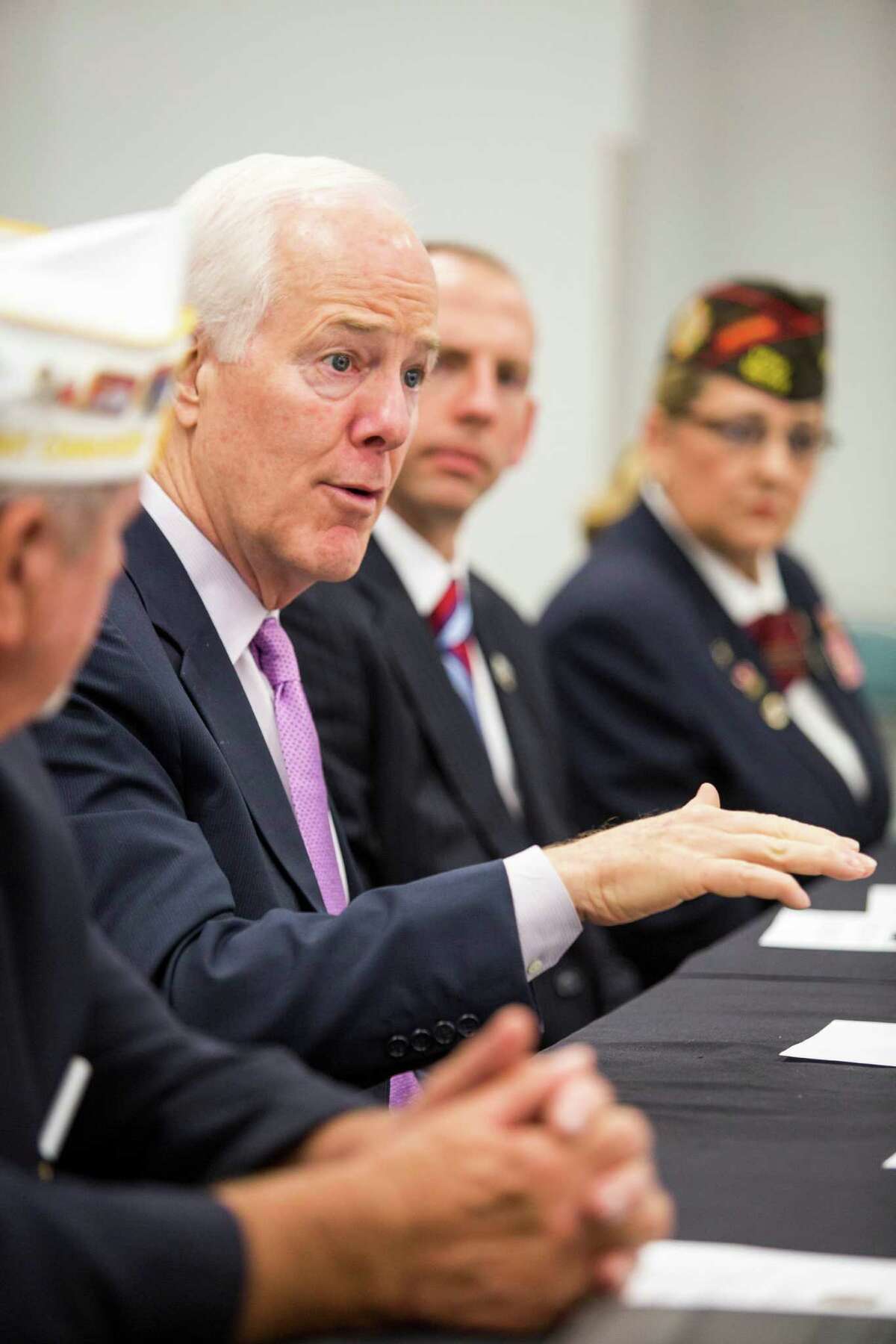 Texas senator John Cornyn speaks to a panel composed of leaders of veterans' groups, veterans and a doctor, May 29, 2014 in Houston at the Trini Mendenhall Sosa Community Center. (Eric Kayne/For the Chronicle)