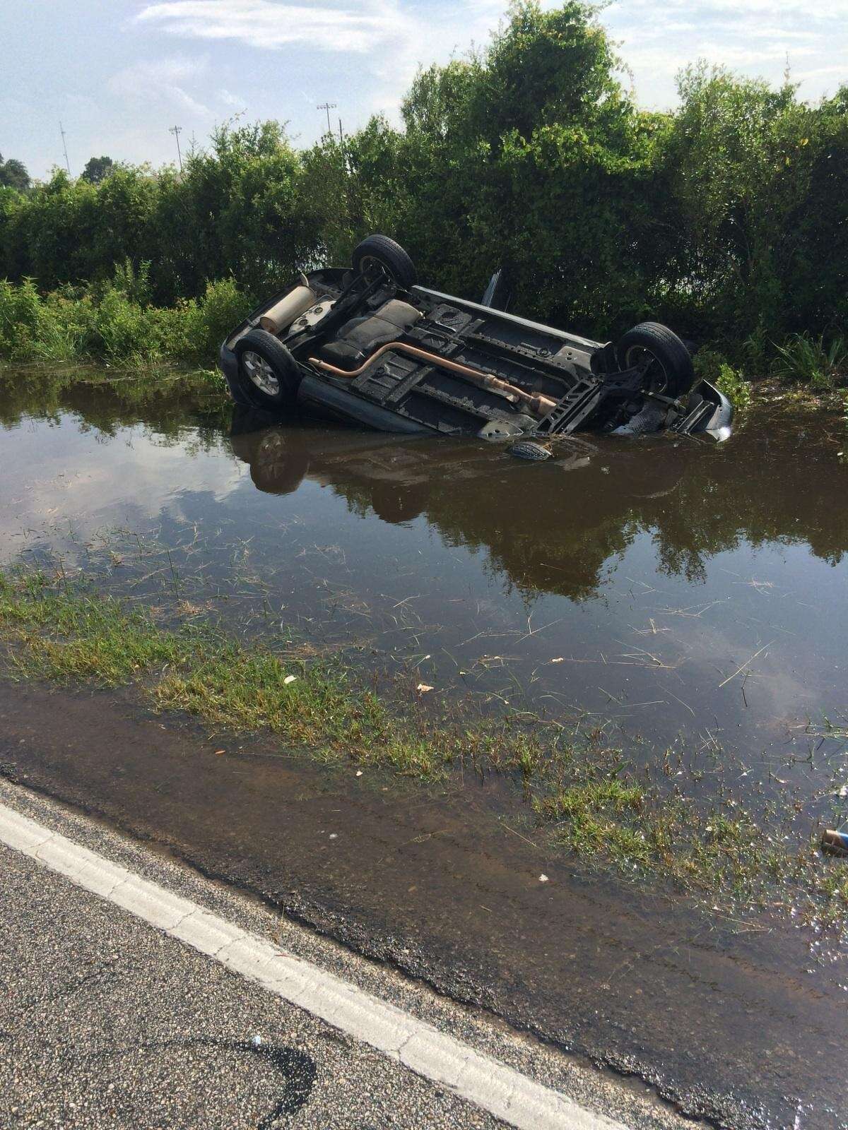 Lt. Shawn Sayers and Deputy Phil Crowell were traveling in the 5500 block of Katy Hockley Cut-Off Road on May 27 when they observed a black car overturned and submerged in the ditch.