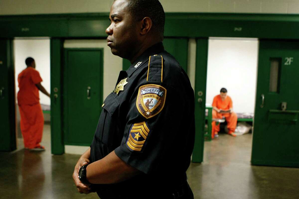 Sgt. Roosevelt Berry looks on as two16 and under juveniles who have been charged as adults for crimes ranging from Class B misdemeanors to capitol murder spend their time at the Harris County Jail on 1200 Baker St. Friday, May 11, 2012, in Houston. A new law states "certified" juveniles, if housed in county jail, can't be housed within "sight or sound" of adult prisoners. "It is impossible for us to abide by these rules," Harris County Sheriff spokesperson Christina Garza said. Due to the way the facility is set up, juvenile inmates will at some point, though kept separate, come with in sight or sound of an adult inmate while on their way to court, recreation time or to see a visitor. ( Johnny Hanson / Houston Chronicle )
