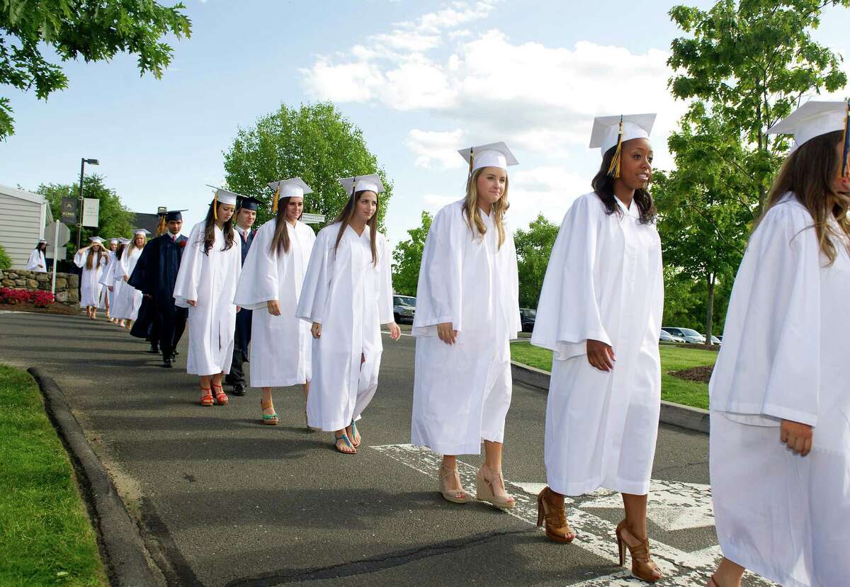 Graduates walk in the processional before their commencement ceremony at King on Friday, May 30, 2014.