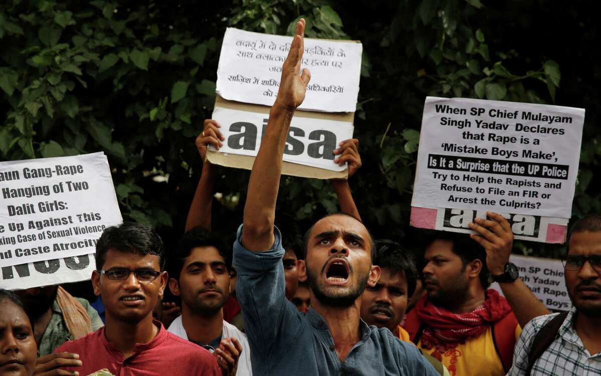 Members of the Jawaharlal Nehru University student union angrily protest Friday against government inaction in the gang rape of two teenage girls.