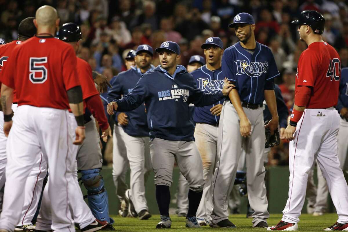 Pitcher David Price (second from right) is held back as the Rays and Red Sox tangle in Boston.
