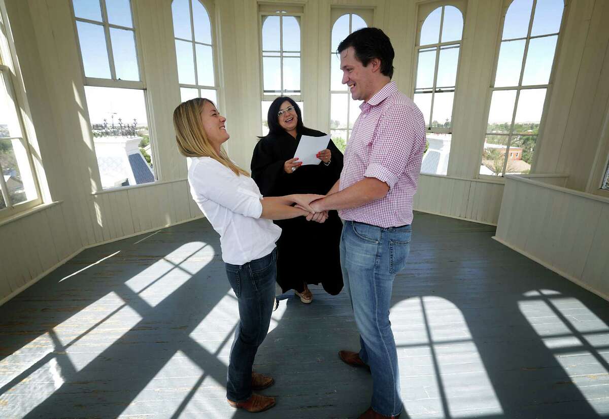 Justice of the Peace Cindy Rice Guevara performs a marriage ceremony for Stephanie Schumann and Bradley Mitchell in the Presidio County Courthouse dome last month. Guevara likely will become the next county judge.