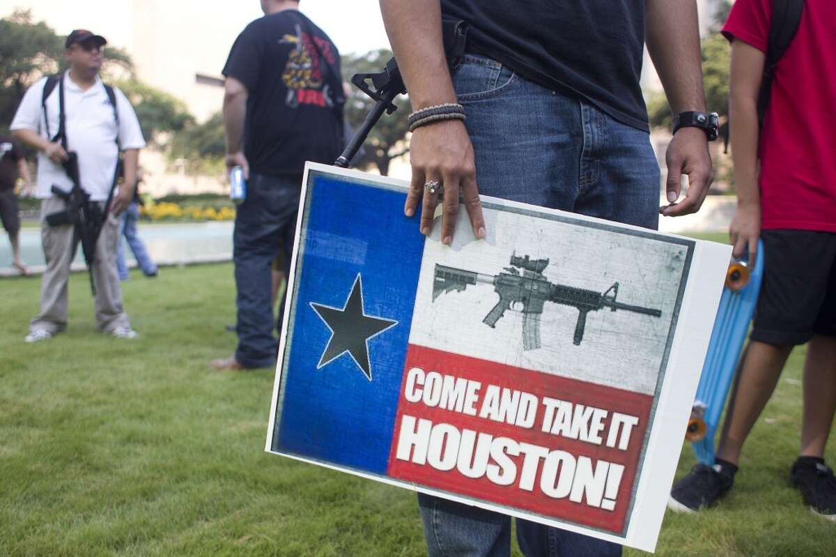 Here's a look at the Texas open carry movement. With guns in hand, a group of more than 20 people with the pro-gun organization, Come and Take it Houston, assembled at City Hall before walking through downtown carrying their guns as part of a rally Thursday, July 4, 2013, in Houston. "This is a Come and Take it Houston walk to help inform citizens about the gun laws here in Texas," co-organizer Kenneth Lindbloom said. "In Texas there are no restrictions on the open carry of long arms like rifles and shotguns. We want people to realize that in the hands of good people, guns are not dangerous and they don't kill people. When good people have guns it serves as a deterrent to stop crime."( Johnny Hanson / Houston Chronicle )