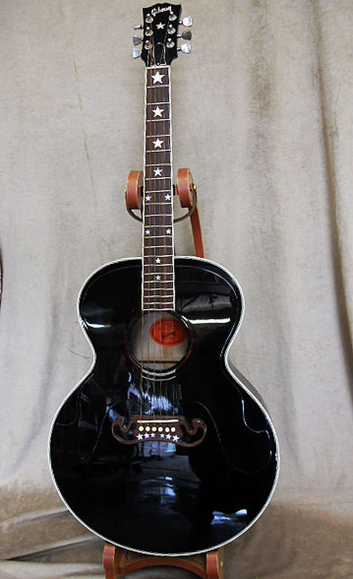 Michael Brown's collectible guitars bring in more than 100,000 at auction