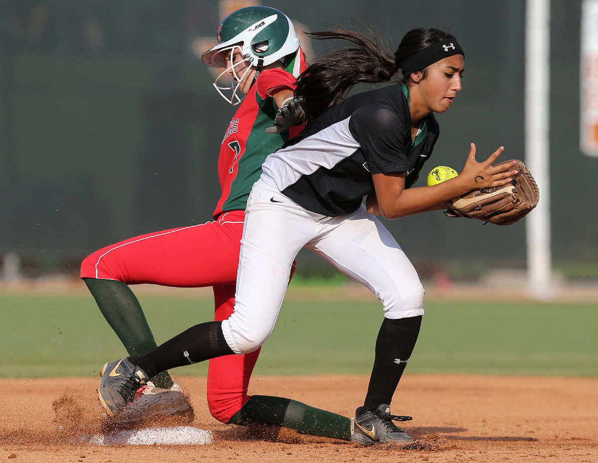 Yanira Fernandez, right, of Southwest HS grabs for the ball as Kaitlyn Stavinoha of The Woodlands reaches second base safely during their state semifinal game in Austin on Friday.