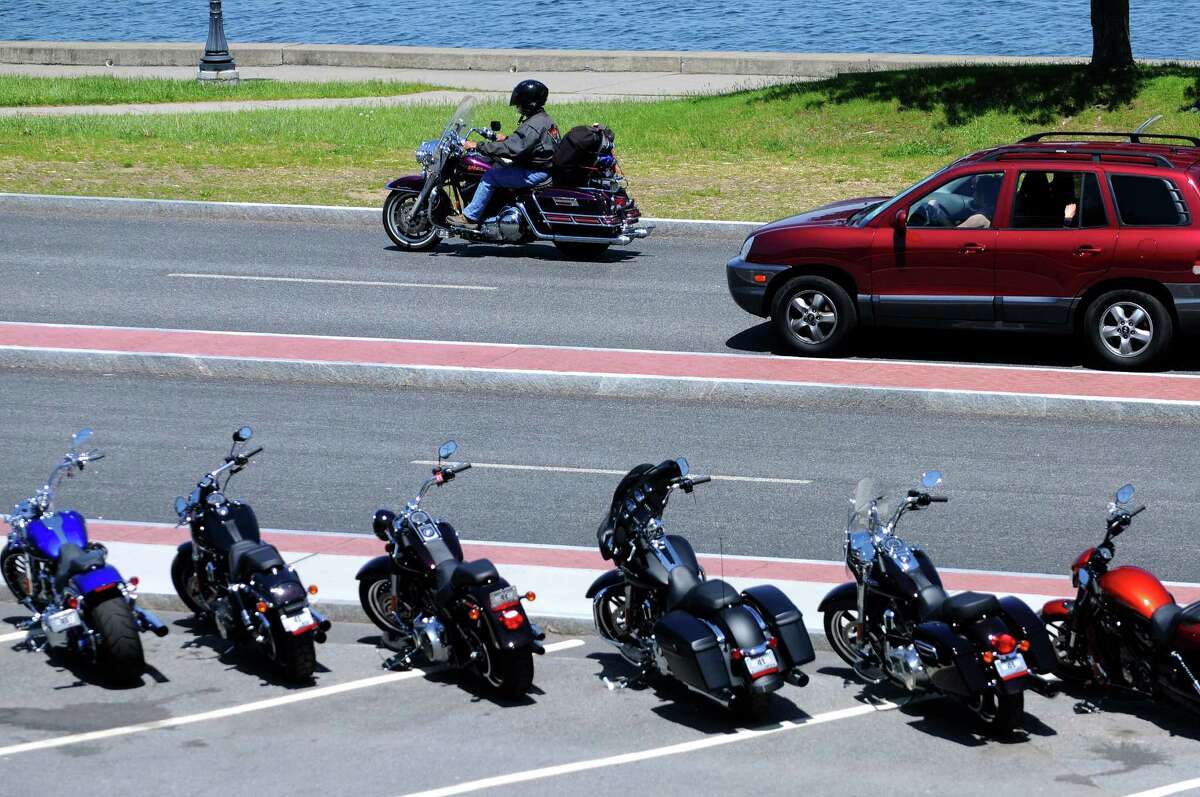 Bikes are lined up along Beach Road as attendees start to arrive for the start of Americade on Monday, June 2, 2014, in Lake George, N.Y.