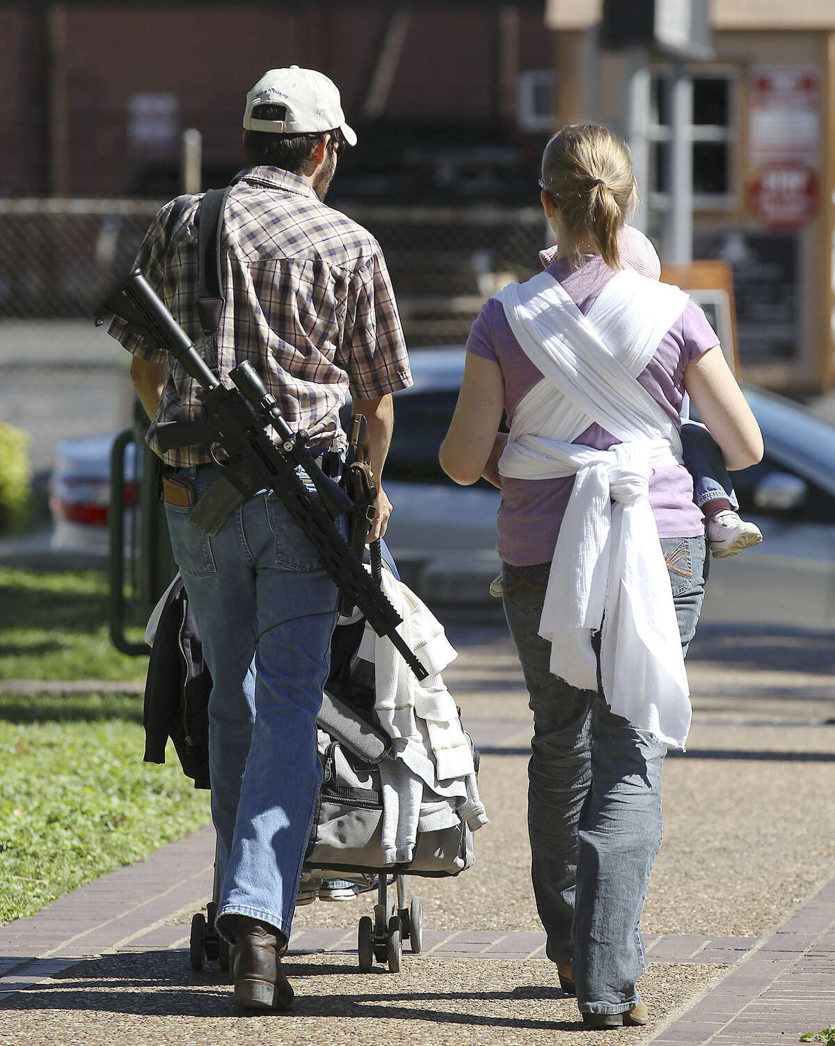 Participants leave a gun-rights rally at Travis Park in October. Advocates of open carrying of handguns have also staged armed protests at the Texas Capitol and along the Red River.