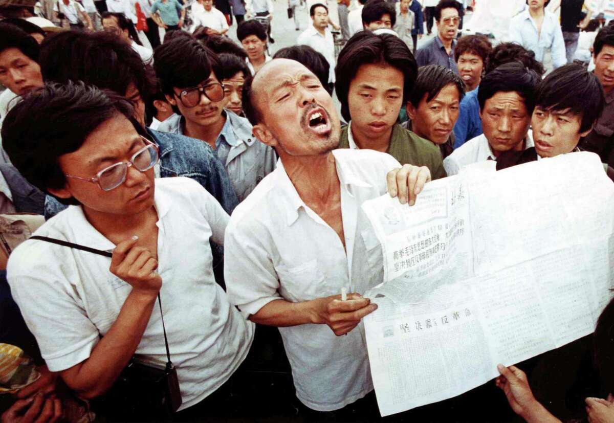 A man who identified himself as a former political prisoner relates his experiences to striking students in Tiananmen Square, Beijing, on May 28, 1989. Students have held the square in a democracy demonstration for more than two weeks.