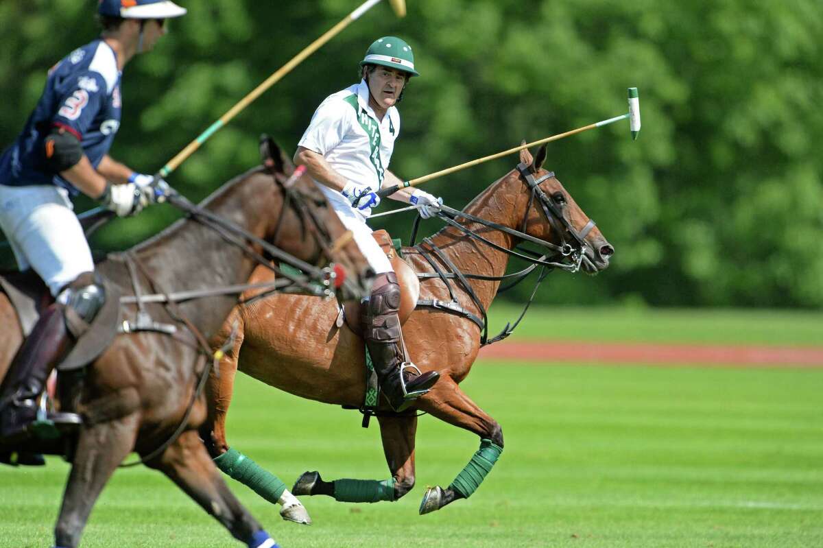 Greenwich resident Peter Brant leads his White Birch team during opening day action at the Greenwich Polo Club on Sunday, June 1, 2014.