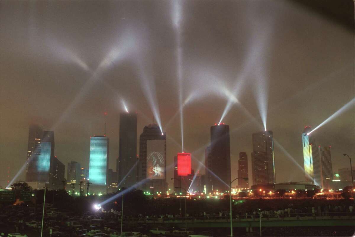Laser beams and visual images on skyscrapers light up the downtown sky in April 1986 during Jean Michel Jarre's "Rendez-Vous Houston: A City In Concert," as part of the Houston International Festival. Keep going to see more images from the monumental concert. 