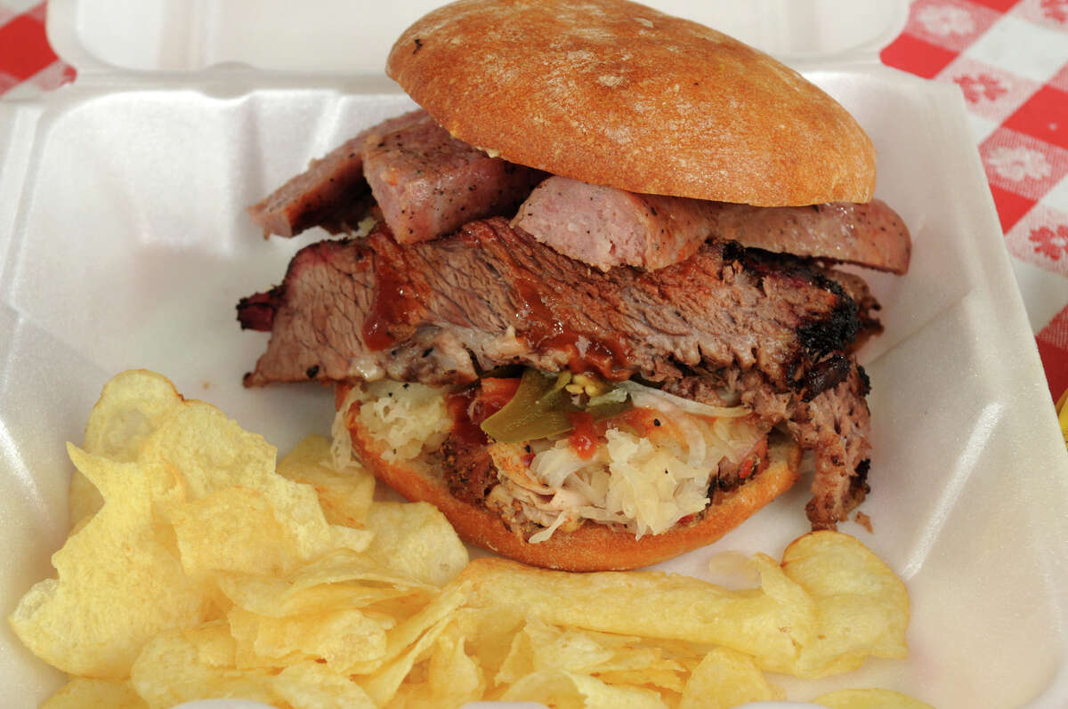 The masterpiece of The Wooden Spoke cuisine in Magnolia is the Big Mike, a 1 1/2 sandwich made with pork loin, barbecue sauce, sausage, jalapeno peppers, onion, sauerkraut, and special sauce all served on a ciabatta bun.