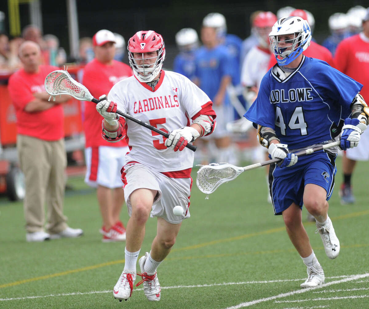 At left, Mike Sullivan (#5) of Greenwich goes for the ball along with Lorin Tobey (#44) of Fairfield Ludlowe during the state playoff lacrosse match between Greenwich High School and Fairfield Ludlowe High School at Greenwich, Wednesday, June 4, 2014.