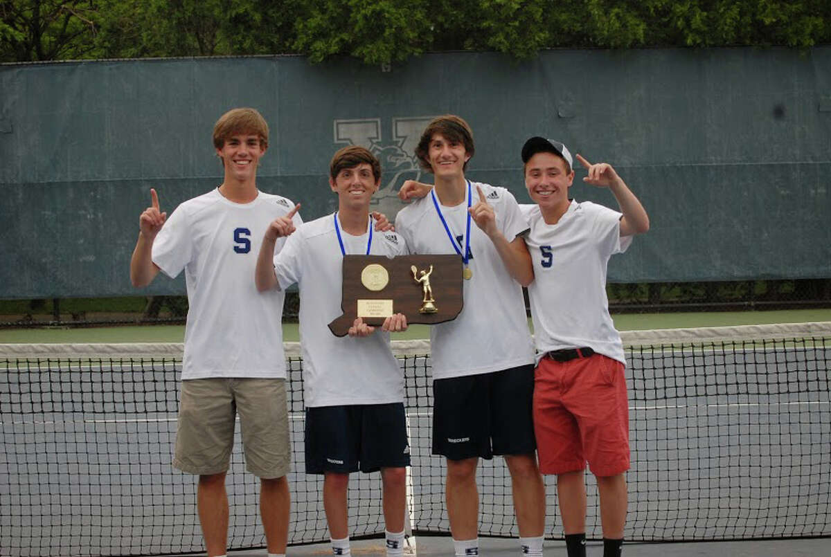 Members of the Staples boys team celebrate winning the Class LL championship on Wednesday. From left: Luke Foreman, Baxter Stein, Connor Mitnick and Jack Reardon.