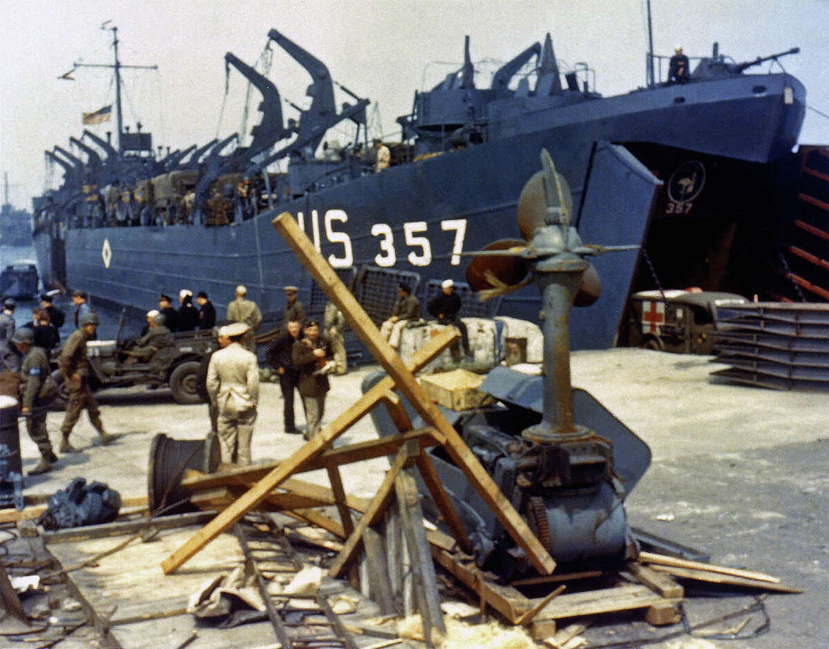 Landing Ship Tank (LST-357) loading an ambulance at Portland Harbour, Dorset, before the D-Day landings, 5th June 1944. It will soon depart to participate in the cross channel invasion of Omaha Beach in Normandy.