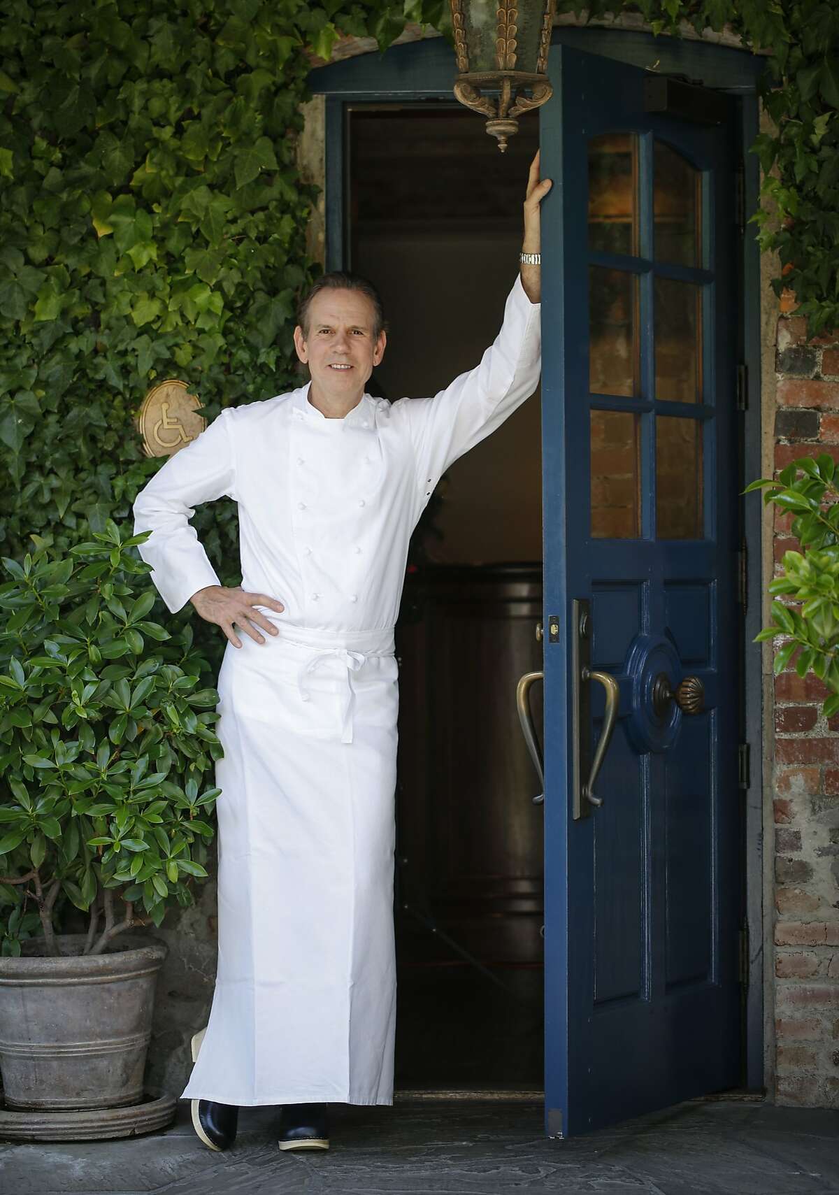 Chef Thomas Keller stands in the doorway of The French Laundry on Wednesday, April 16, 2014 in Yountville, Calif.