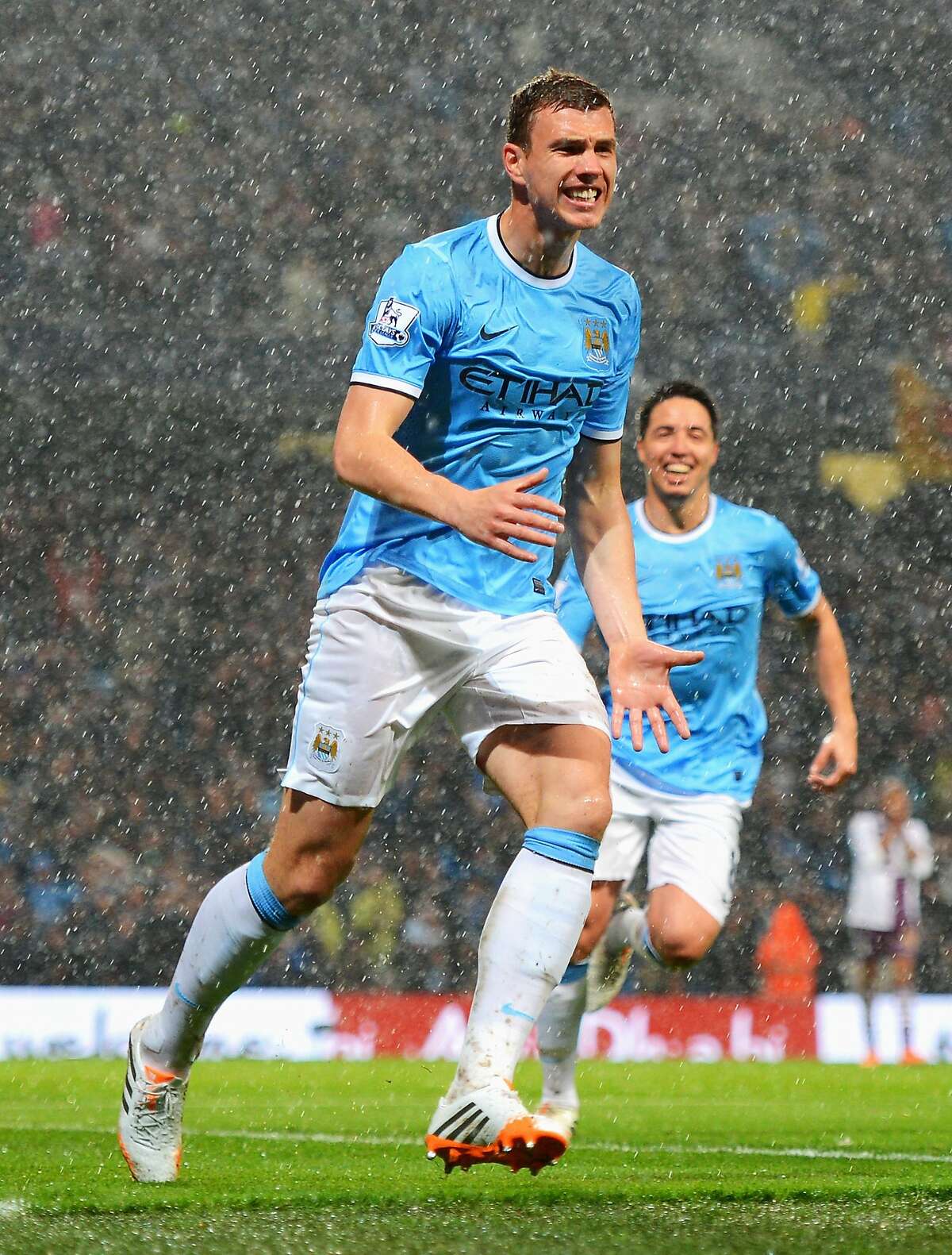 MANCHESTER, ENGLAND - MAY 07: Edin Dzeko of Manchester City celebrates scoring the opening goal during the Barclays Premier League match between Manchester City and Aston Villa at Etihad Stadium on May 7, 2014 in Manchester, England. (Photo by Michael Regan/Getty Images)