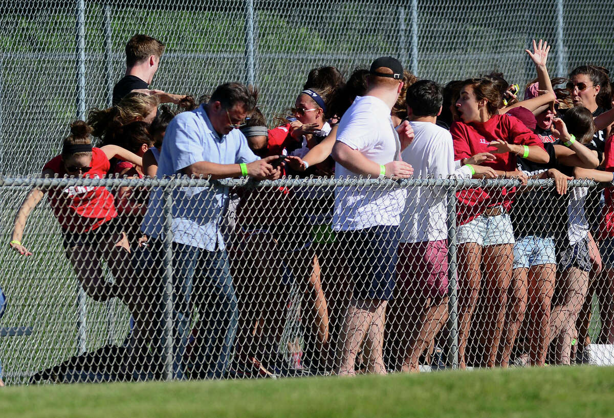A row of bleachers full of Fairfield Warde students collapsed during the Trumbull baseball game, injuring at least three people, in Trumbull, Conn. on Friday June 6, 2014.