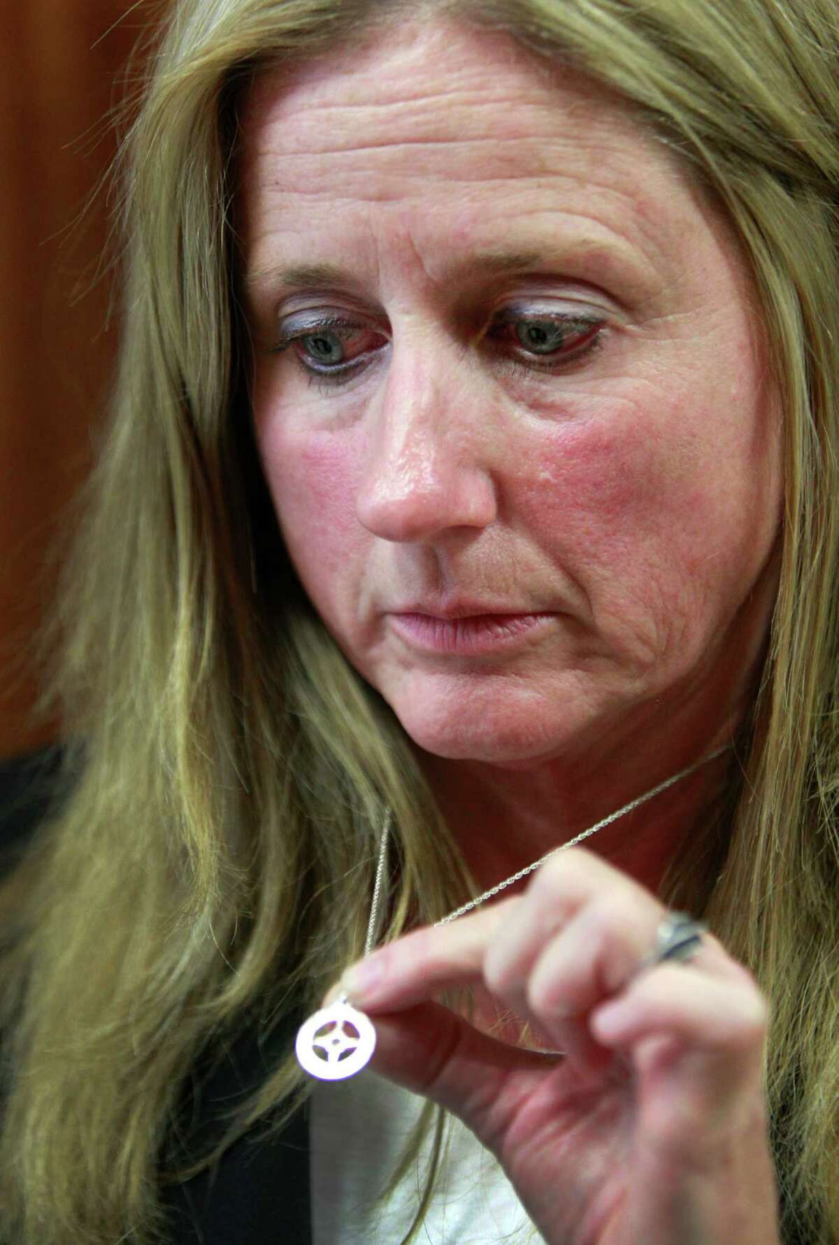 Donna Malone wears a necklace belonging to her murdered daughter, Michelle Warner, mother of two, who was strangled by her boyfriend, Mark Castellano, who first claimed she abandoned her kids.