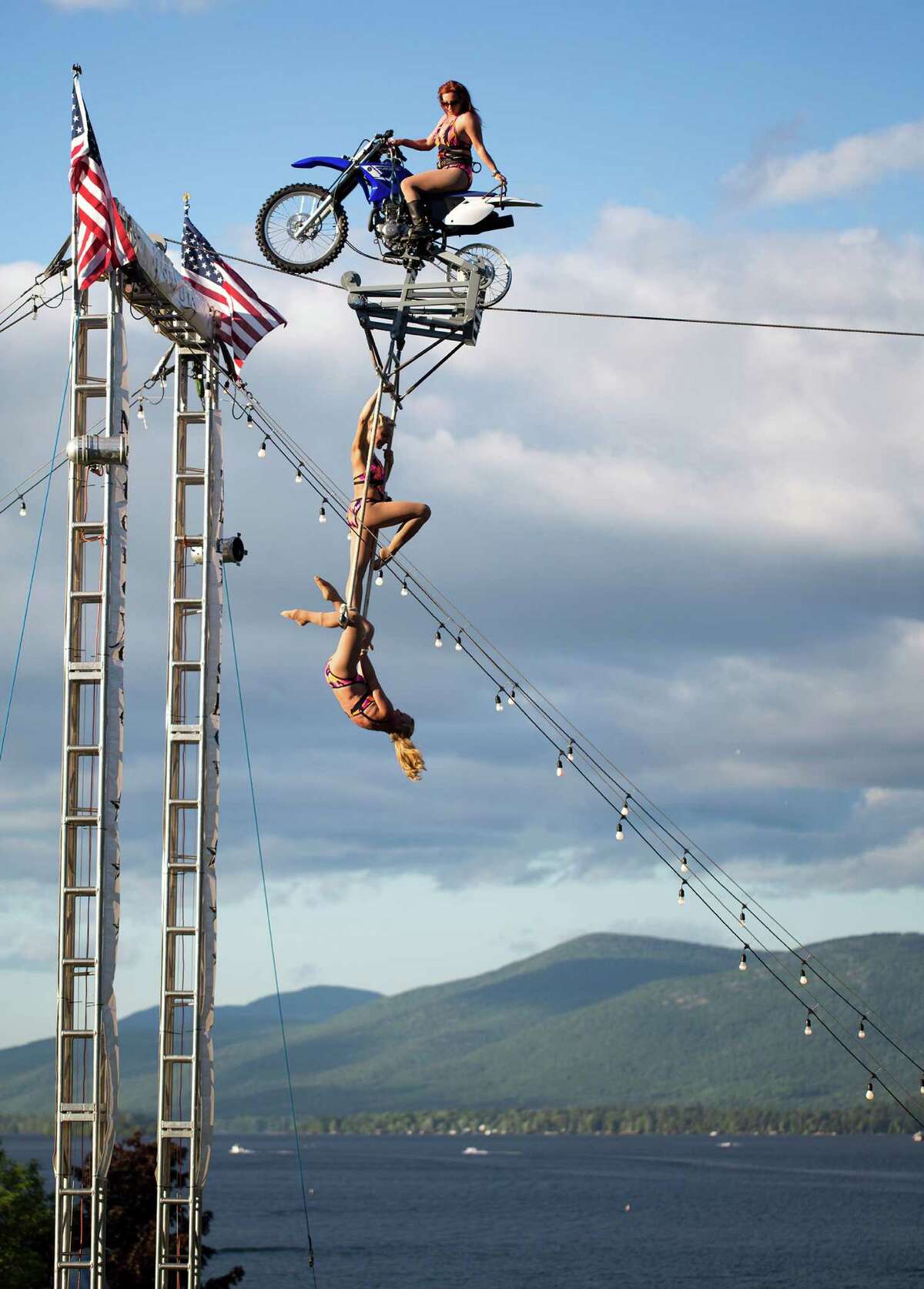 The Circus Una all women's group performs their motorcycle tightrope act during the Americade motorcycle rally in Lake George, N.Y. on Friday, June 6, 2014. 
