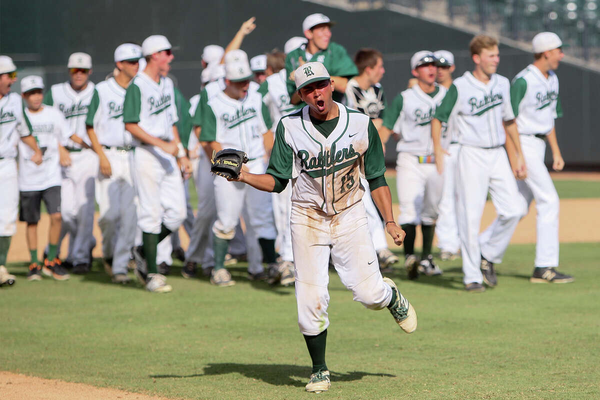 Reagan's Drew Brooks (15) and the rest of the team celebrate their 5-4 victory over Humble Atascocita in their UIL Class 5A state semi-final game at Dell Diamond in Round Rock on Friday, June 6, 2014. MARVIN PFEIFFER/ mpfeiffer@express-news.net