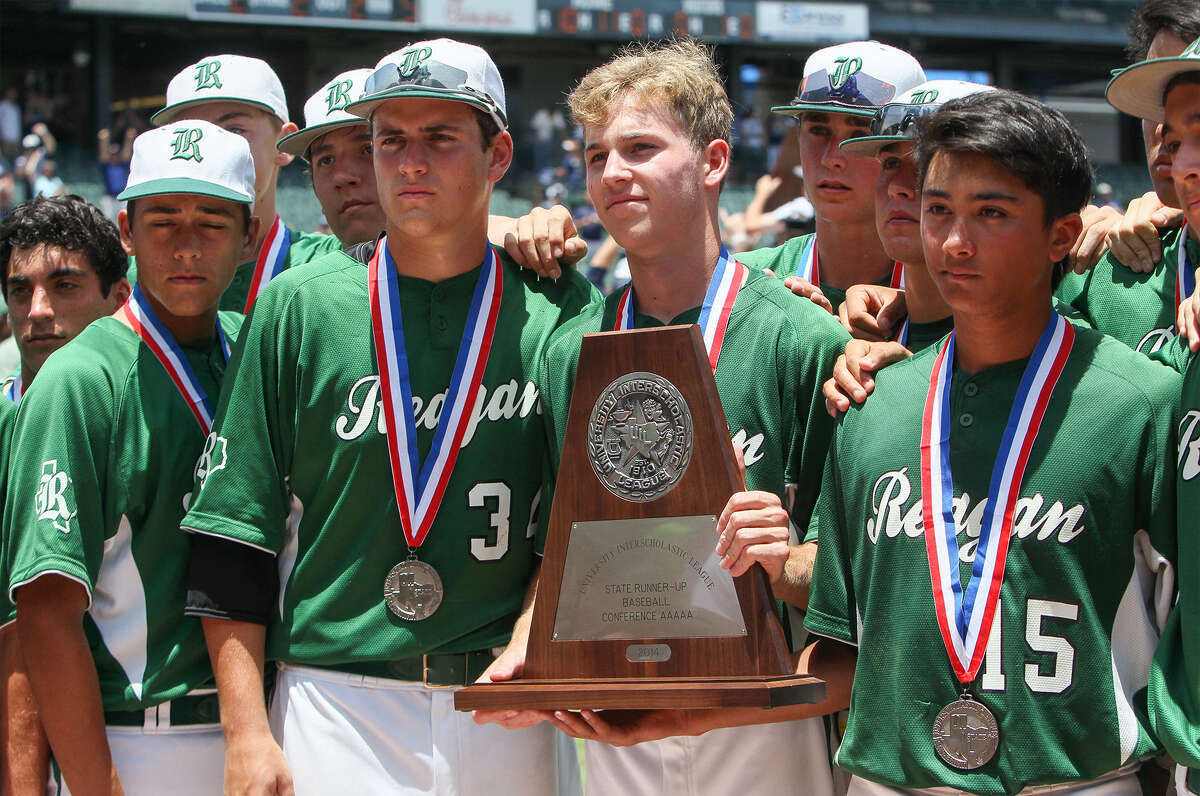 Reagan players accept their runner-up trophy and medals after their Class 5A state final loss to Flower Mound in Round Rock.