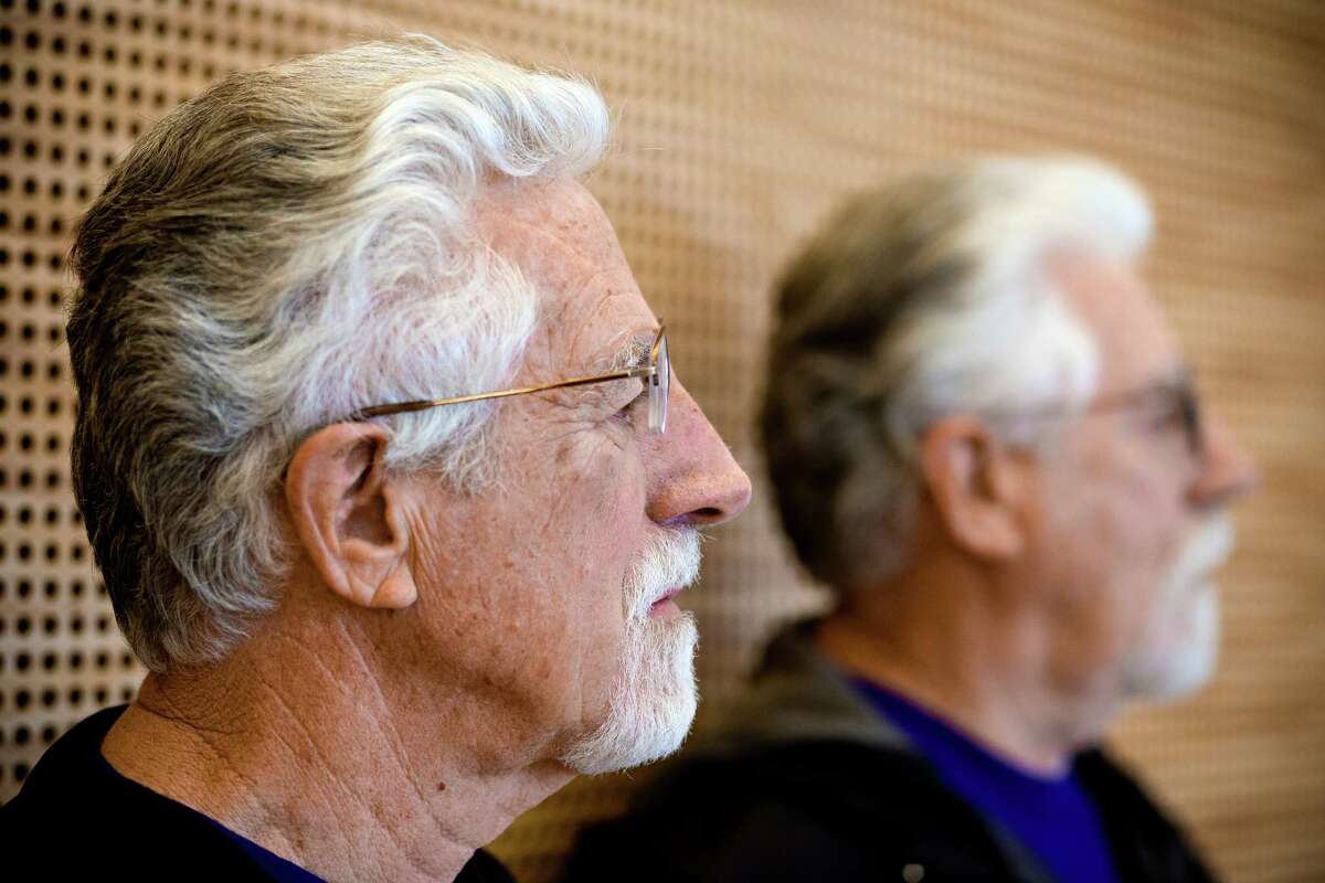 Don, left, and Dave, listen to UW Twin Registry director Glen Duncan at the first-ever Twinfest Saturday, June 7, 2014, at the University of Washington in Seattle. The purpose of the event was to raise awareness of the UW Twin Registry and the value of twin research. More than 120 pairs of twins met at the event.