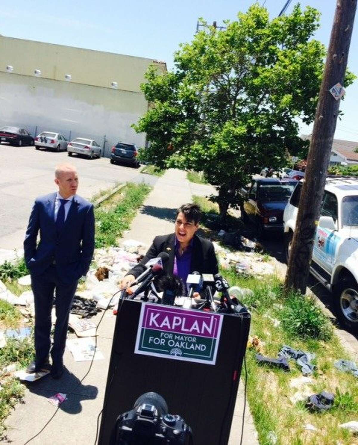 Oakland City Council member Rebecca Kaplan uses backdrop of street garbage at 92nd Avenue and International Boulevard to announce her run for mayor.ÊÊ