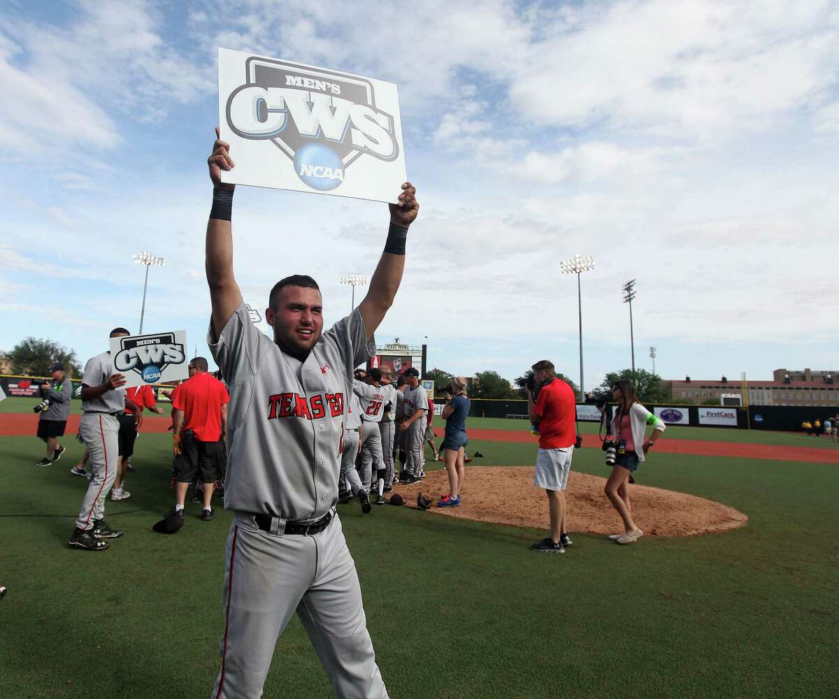 Texas Tech's Eric Gutierrez holds up a College World Series sign after a win over College of Charleston in a NCAA college baseball super regional tournament game in Lubbock,Texas, Sunday, June 8, 2014. (AP Photo/Lubbock Avalanche Journal,Zach Long) LOCALTV OUT