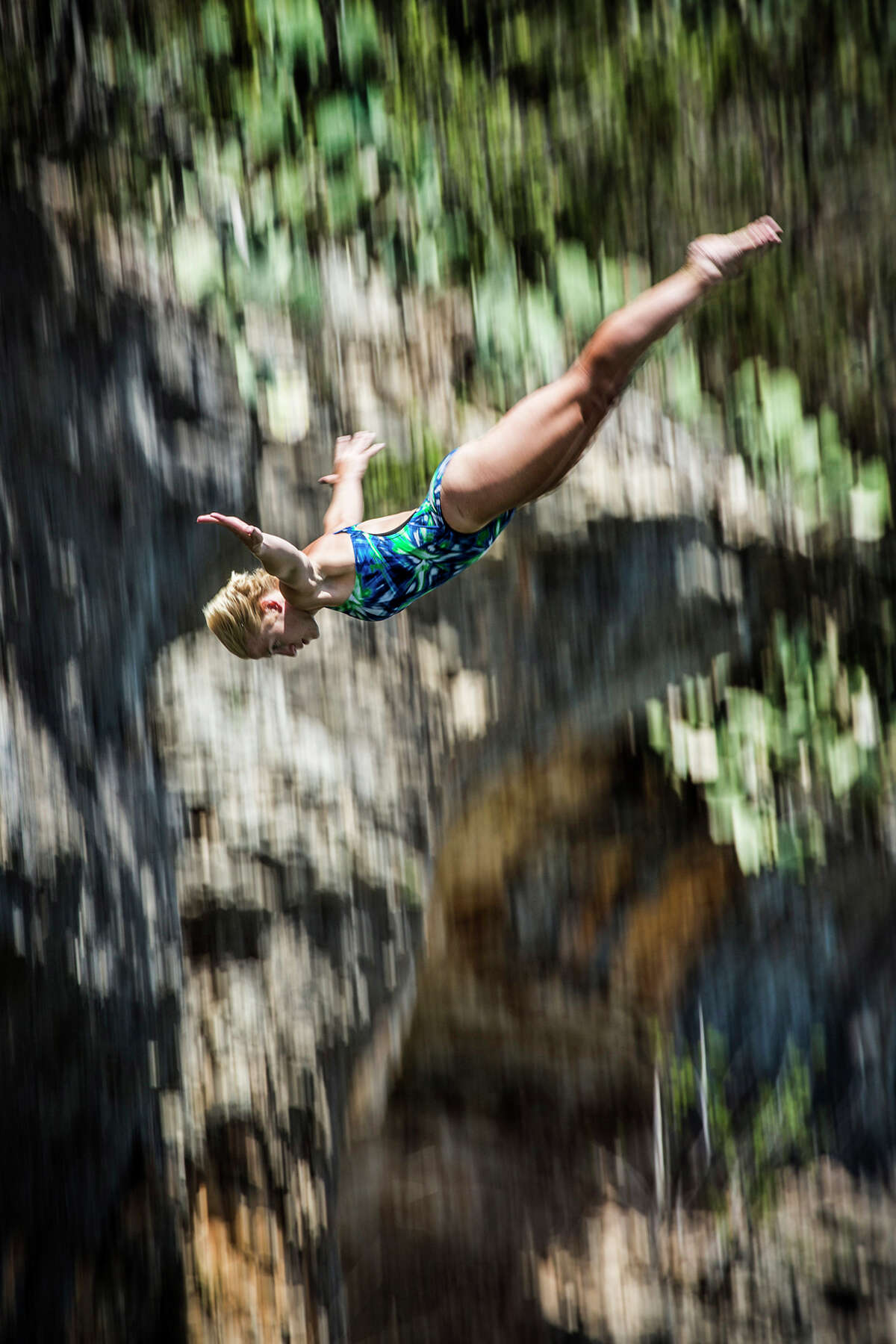 Cesilie Carlton of the USA dives from the 20-meter platform at Hells Gate during the second training session of the second stop of the Red Bull Cliff Diving World Series on June 6, 2014 in Possum Kingdom Lake, Texas.