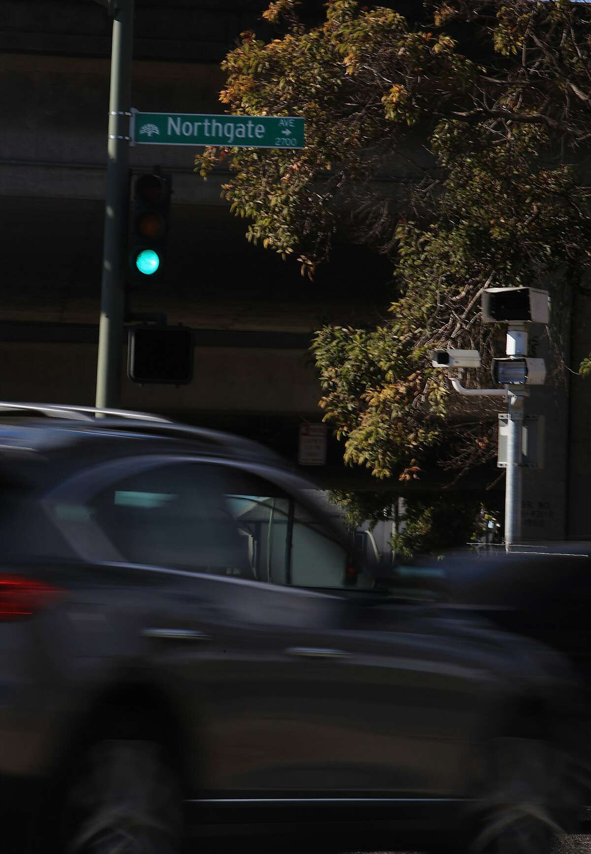 In this file photo,  a red light camera unit is seen at the 27th St. and Northgate Avenue next to an on ramp to I-580 in Oakland.
