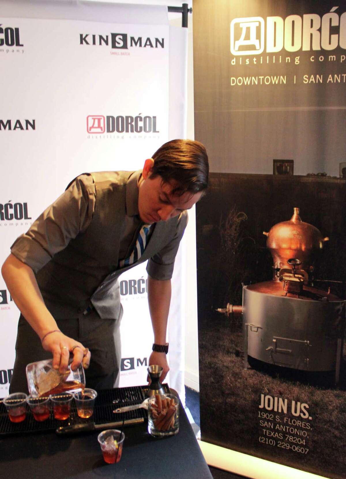 A bartender for Dorcol Distilling Co. makes drinks during the San Antonio Cocktail Conference.