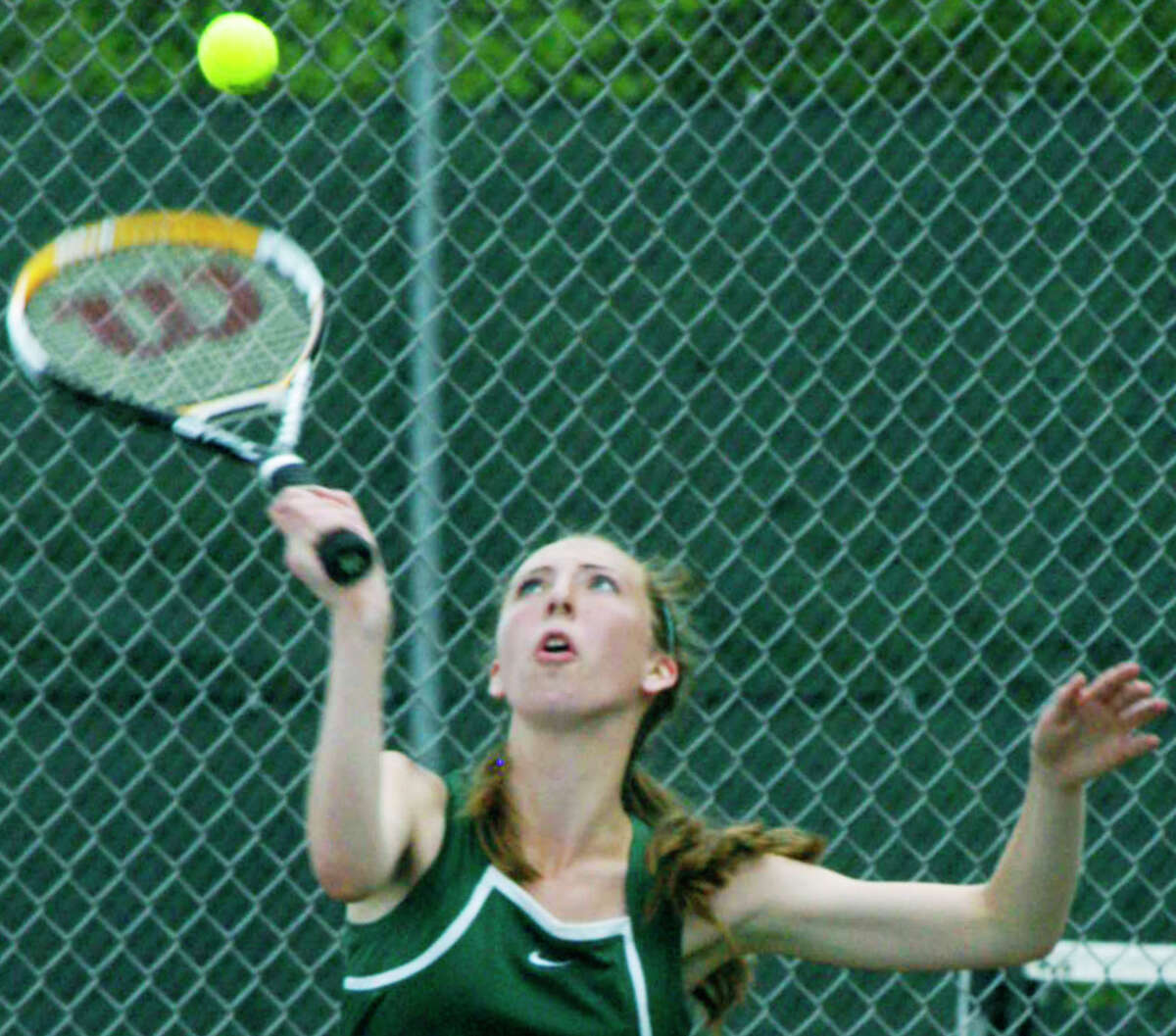 Samantha McNally of the Green Wave delivers a serve during New Milford High School girls' tennis' 4-3 victory over Immaculate, May 14, 2014 at NMHS.