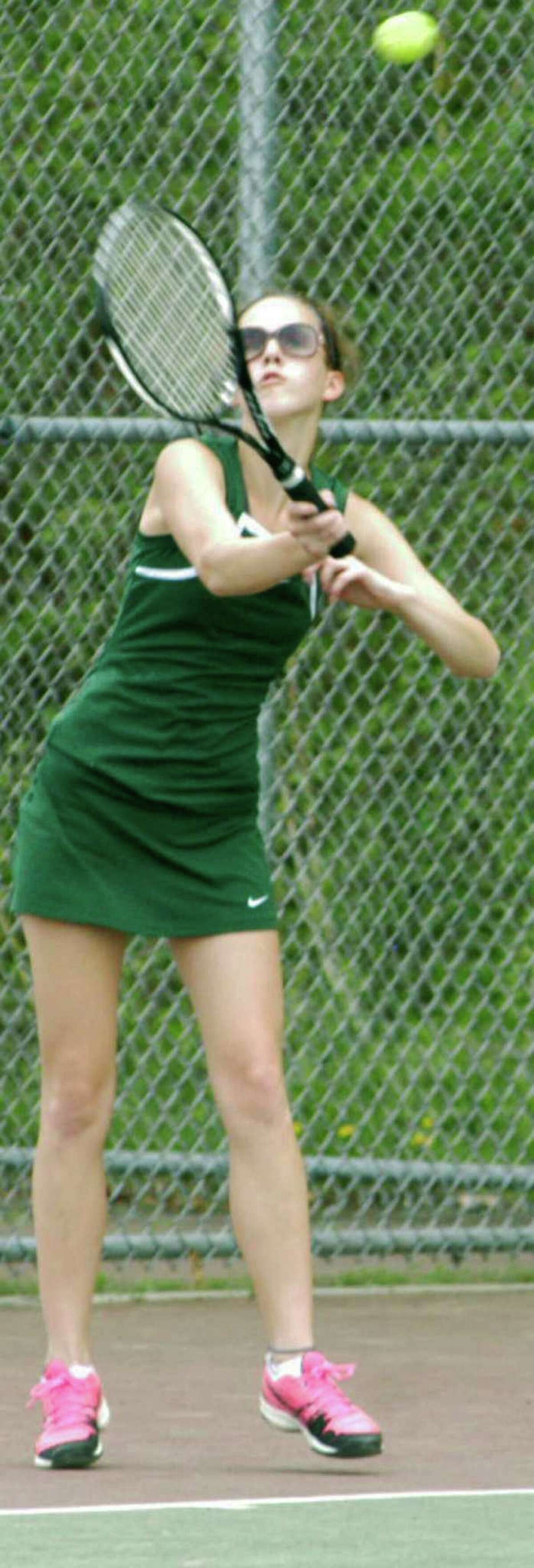 The Green Wave's Sarah Dengler leans into a serve during New Milford High School girls' tennis' 4-3 victory over Immaculate, May 14, 2014 at NMHS.