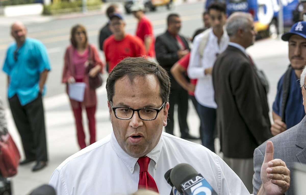 Alex Caputo-Pearl, then president elect of United Teachers Los Angeles, takes questions on about the verdict of the Vergara v. California lawsuit in Los Angeles Tuesday, June 10, 2014. A judge struck down tenure and other job protections for California's public school teachers as unconstitutional, saying such laws harm students, especially poor and minority ones, by saddling them with bad teachers. (AP Photo/Damian Dovarganes)