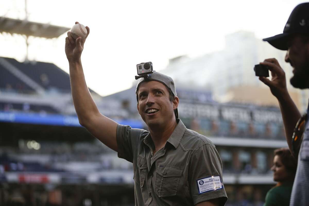 Nick Woodman, the founder and CEO of GoPro, wears a camera on his head before throwing out a ceremonial first pitch before the San Diego Padres play the Washington Nationals in a baseball game Friday, June 6, 2014, in San Diego. (AP Photo/Gregory Bull)