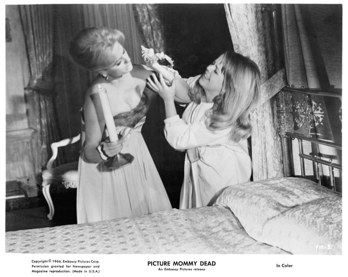 Martha Hyer fights Susan Gordon in a scene from the film "Picture Mommy Dead," 1966.