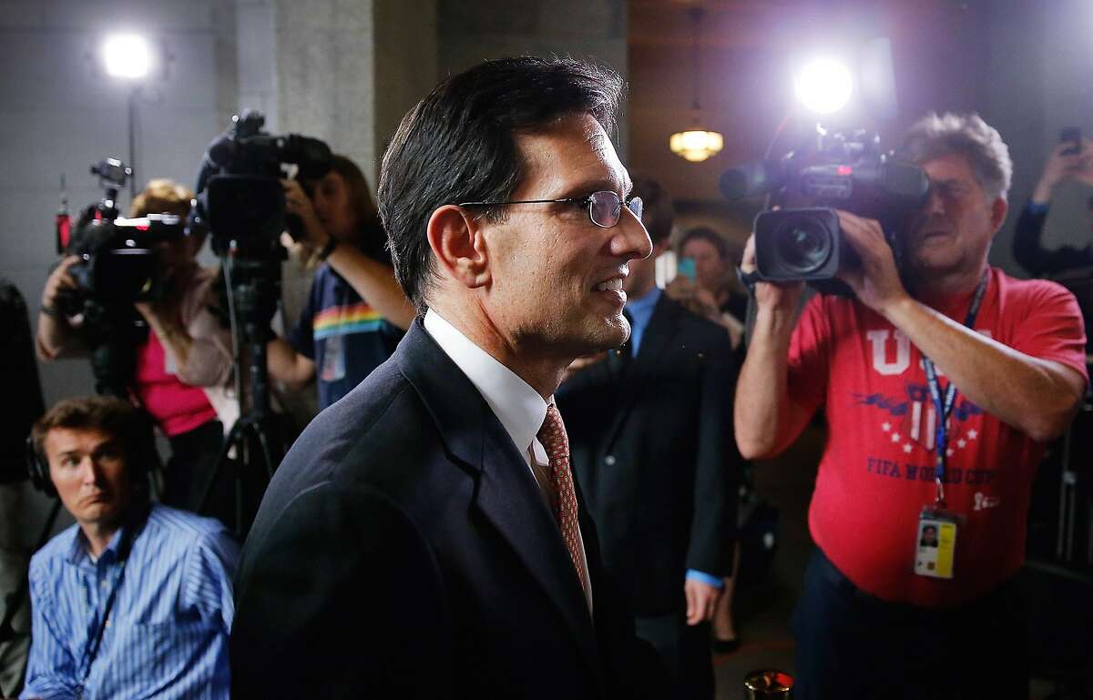 WASHINGTON, DC - JUNE 11: House Majority Leader Eric Cantor (R-VA) departs a news conference after telling the Republican caucus that he will resign his post at the U.S. Capitol June 11, 2014 in Washington, DC. Cantor announced that he will resign his leadership position in the House of Representatives on July 31 after losing a primary race to Tea Party-backed college professor David Brat. (Photo by Win McNamee/Getty Images)