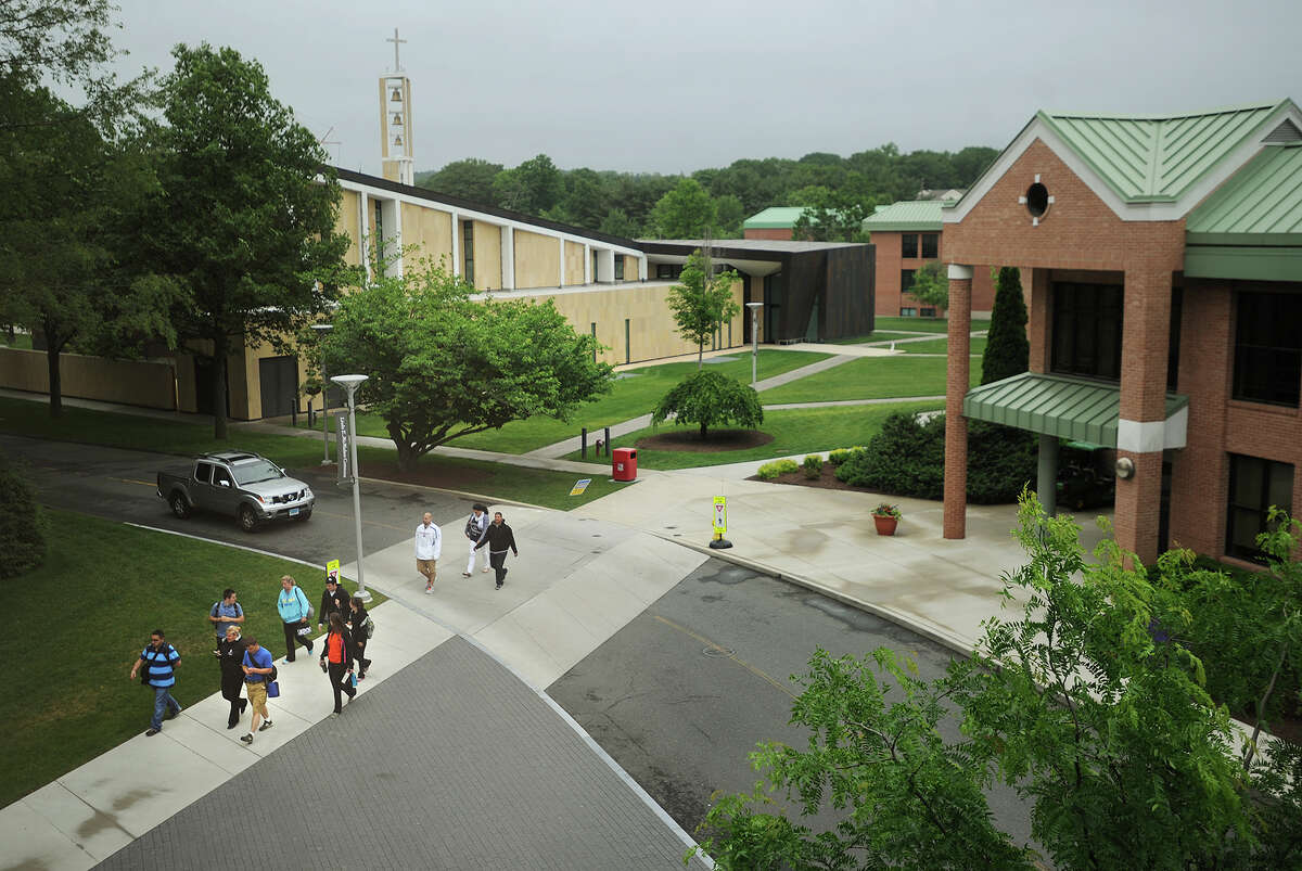 Students walk across the Sacred Heart University campus in Fairfield, Conn. on Sunday, June 12, 2014.