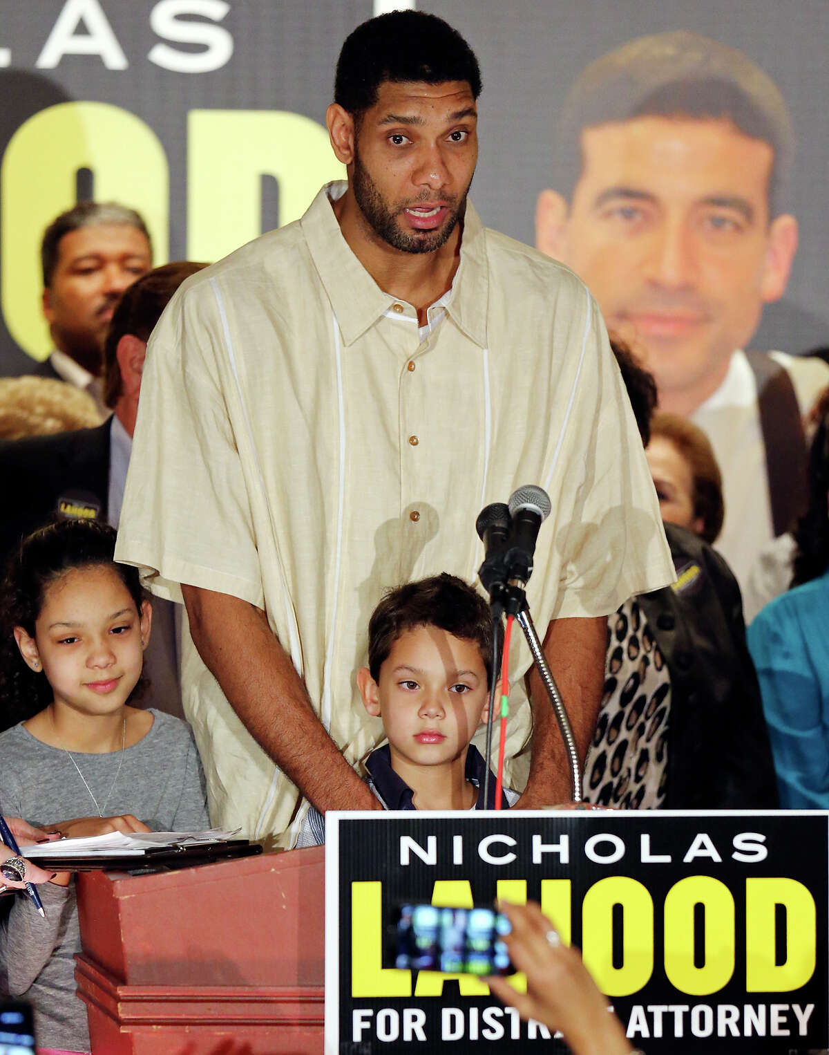 Spurs' Tim Duncan, with his children Sydney (left) and Draven, speaks during Nicholas LaHood's kickoff campaign event for district attorney Saturday Jan. 18, 2014 at the St. Paul Community Center.