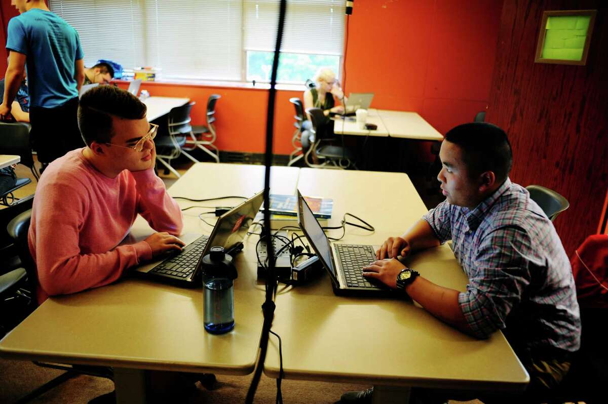 Seniors, Troy O'Neill, left, 17, and Cullen Utermark, 17, work on their computers at Tech Valley High School on Wednesday, June 11, 2014, in Rensselaer, N.Y. (Paul Buckowski / Times Union)