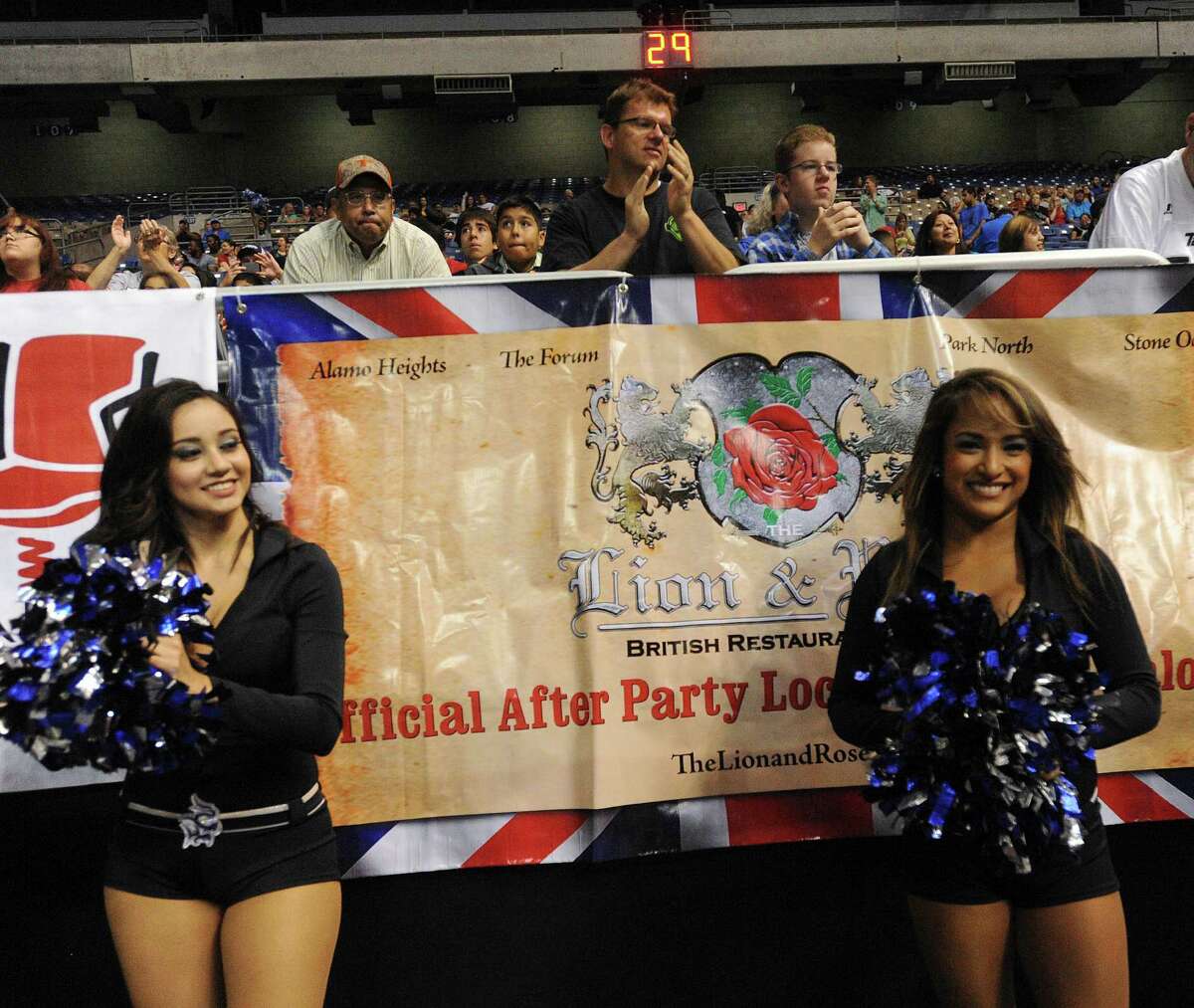 Fans and Sky Dancers watch the action on the field as the San Antonio Talons take on the Arizona Rattlers in Arena Football League action in the Alamodome on Saturday, June 14, 2014.