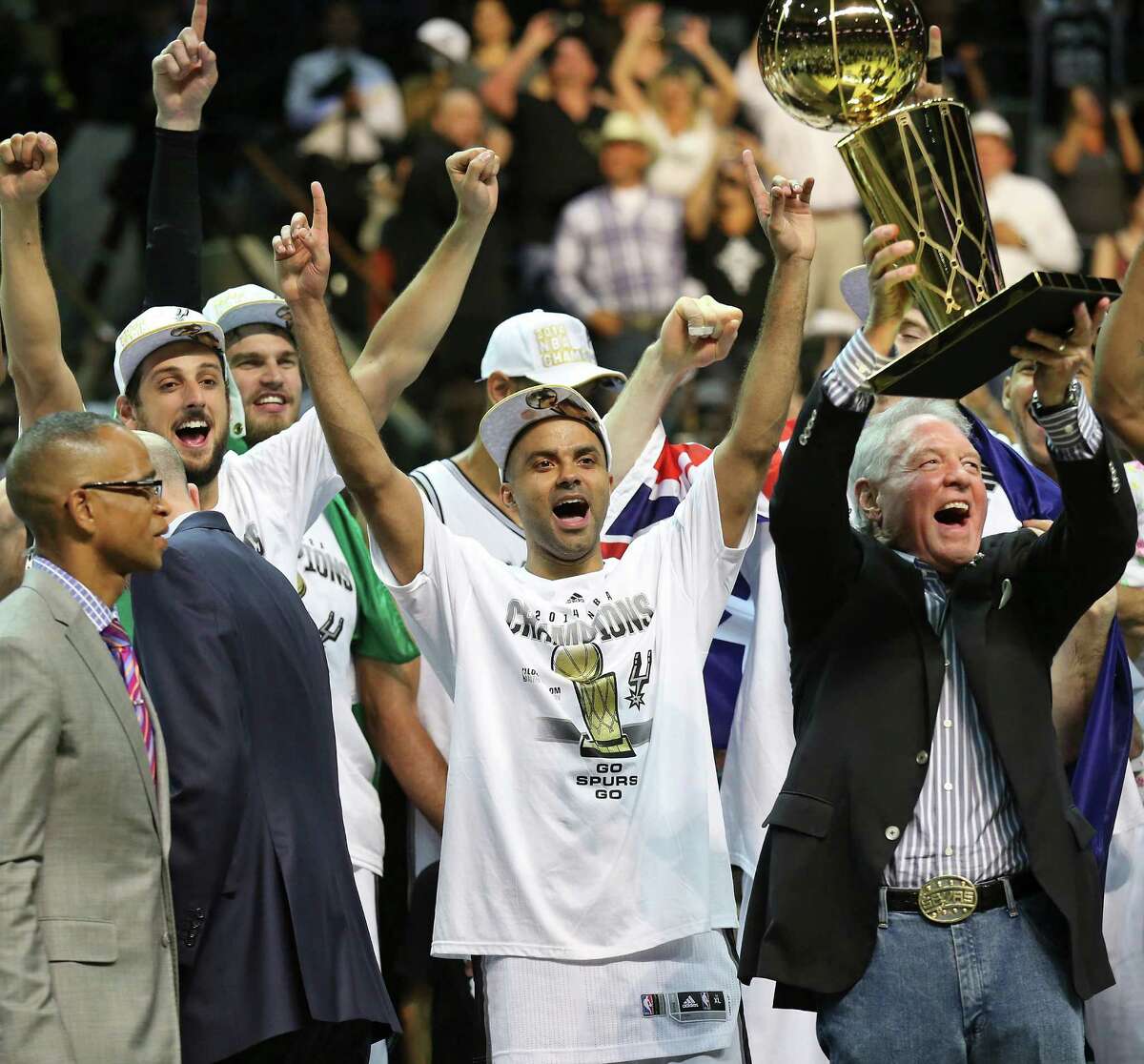 The San Antonio Spurs celebrate with the Larry O'Brien trophy
