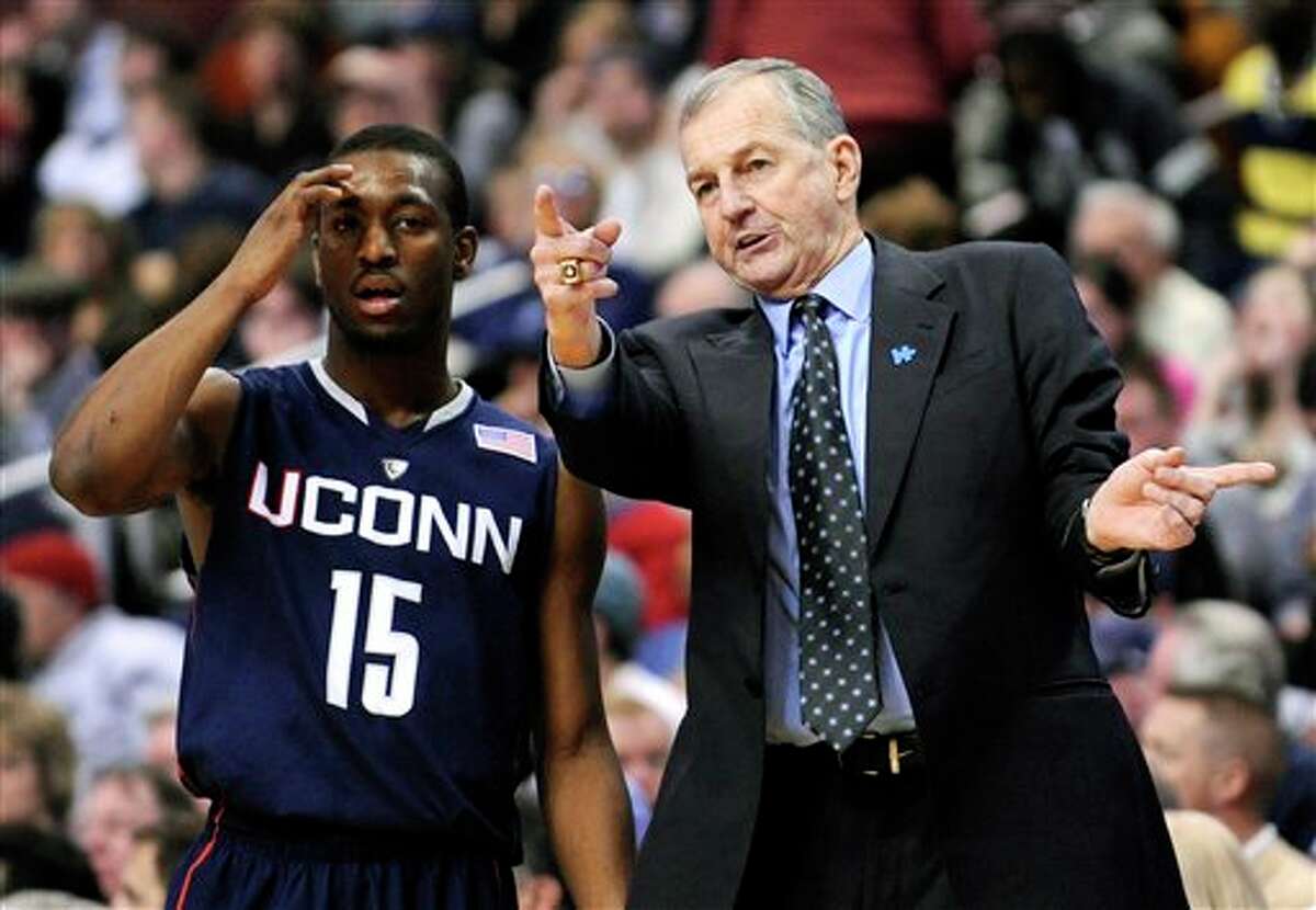 Connecticut coach Jim Calhoun talking to guard Kemba Walker (15) during a break in play in the second half of an NCAA college basketball game against Villanova on Monday, Feb. 15, 2010, in Philadelphia. Connecticut won 84-75. (AP Photo/Michael Perez)