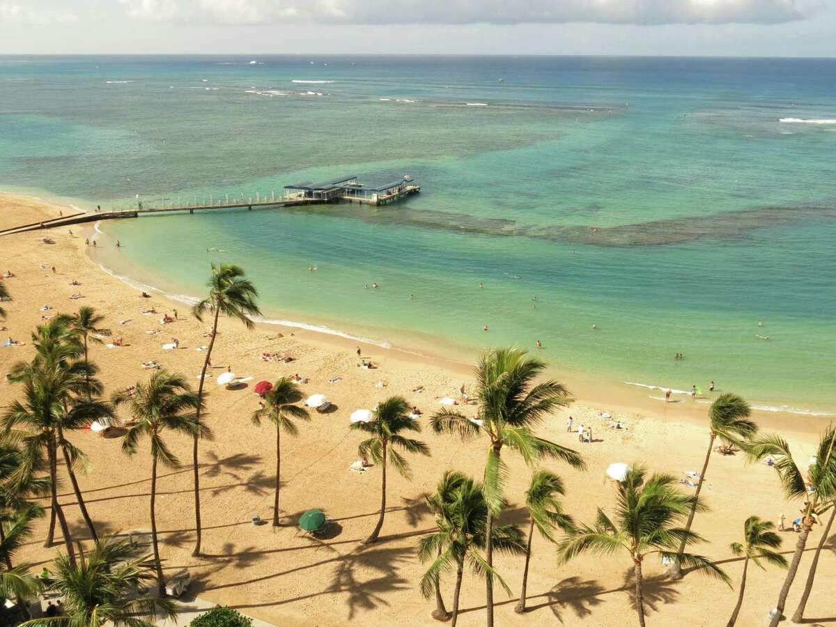 This May 21, 2014 photo shows Duke Kahanamoku Beach in the Honolulu tourist neighborhood of Waikiki in Hawaii. The destination topped this year's annual ranking of the best public beaches in the United States as chosen by Stephen Leatherman, better known as Dr. Beach.