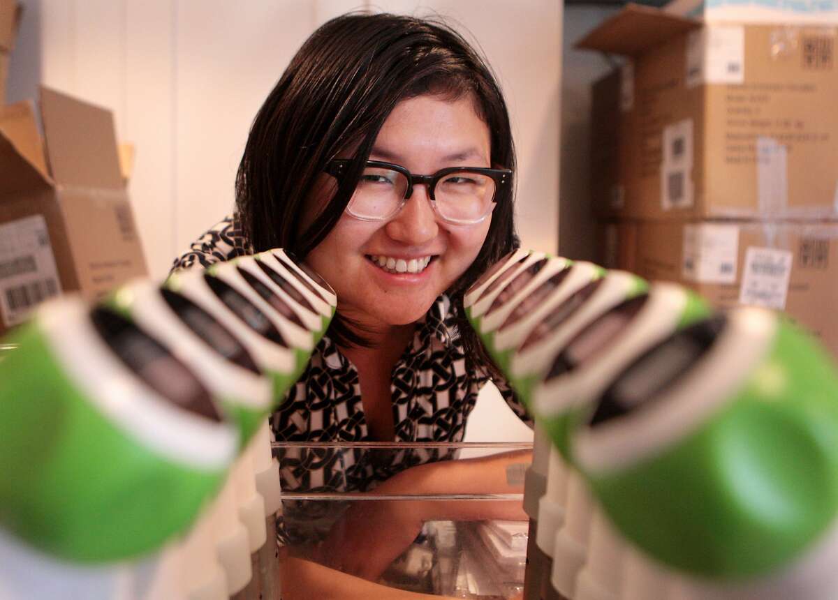 Nomiku CEO Lisa Qiu Fetterman with many of the sous-vide immersion cooking devices she helped create at their Mission District headquarters on Monday, June 16, 2014 in San Francisco, Calif.