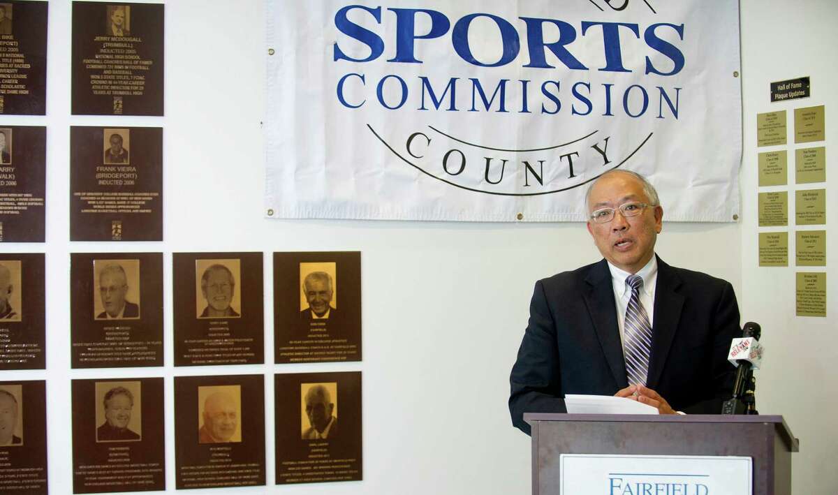 Wha Chu speaks during a ceremony to announce the new inductees into the Fairfield County Sports Hall of Fame, which include Chu's daughter, Julie Chu, at UCONN Stamford on Tuesday, June 17, 2014. The new inductees are Craig Breslow and Julie Chu into the professional wing, Nadine Domond and Mickey Connolly into the amateur wing, and Efrain "Chico" Chacurian, John "Sharkey" Laureno, and Marty Roos into the community service wing.