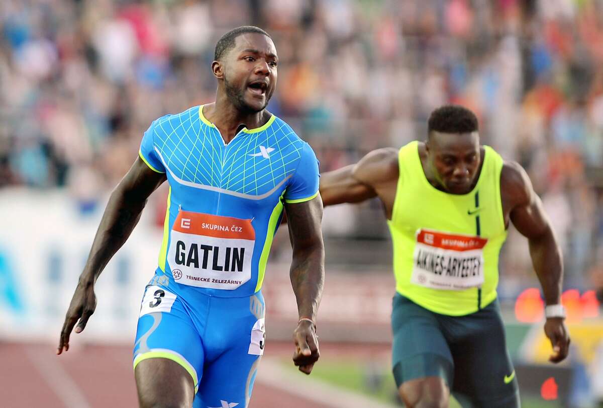 Justin Gatlin from USA, left, reacts as he wins the men's 100m race at the Golden Spike Athletic meeting in Ostrava, Czech Republic, Tuesday, June 17, 2014. (AP Photo/CTK, Jaroslav Ozana) SLOVAKIA OUT