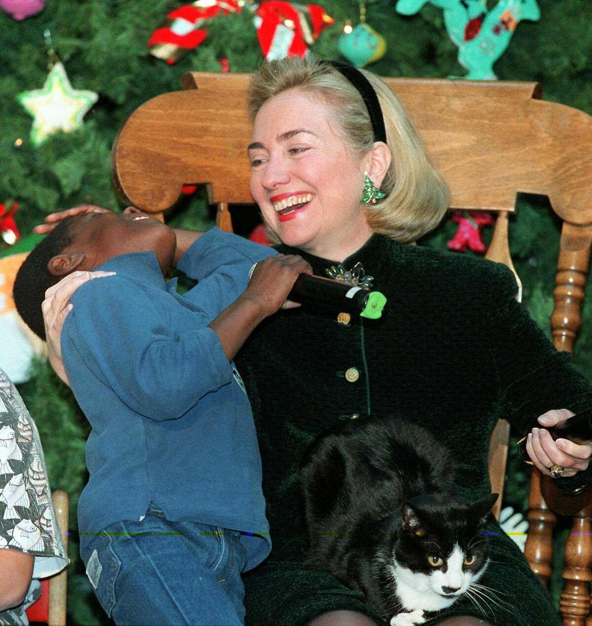 Then-first lady Hillary Rodham Clinton in 1996 with Kwadwo Nyamekye Asante, 6, a patient at Washington's National Medical Center. Ron Edmonds/Associated Press